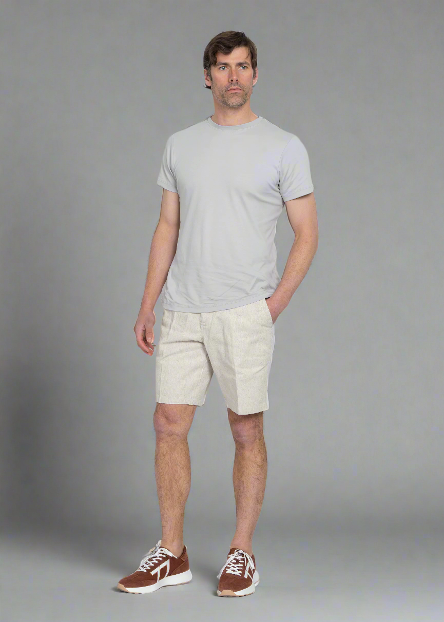 Model standing in the hemp shorts, full-length view showing the fit through the seat and thigh.