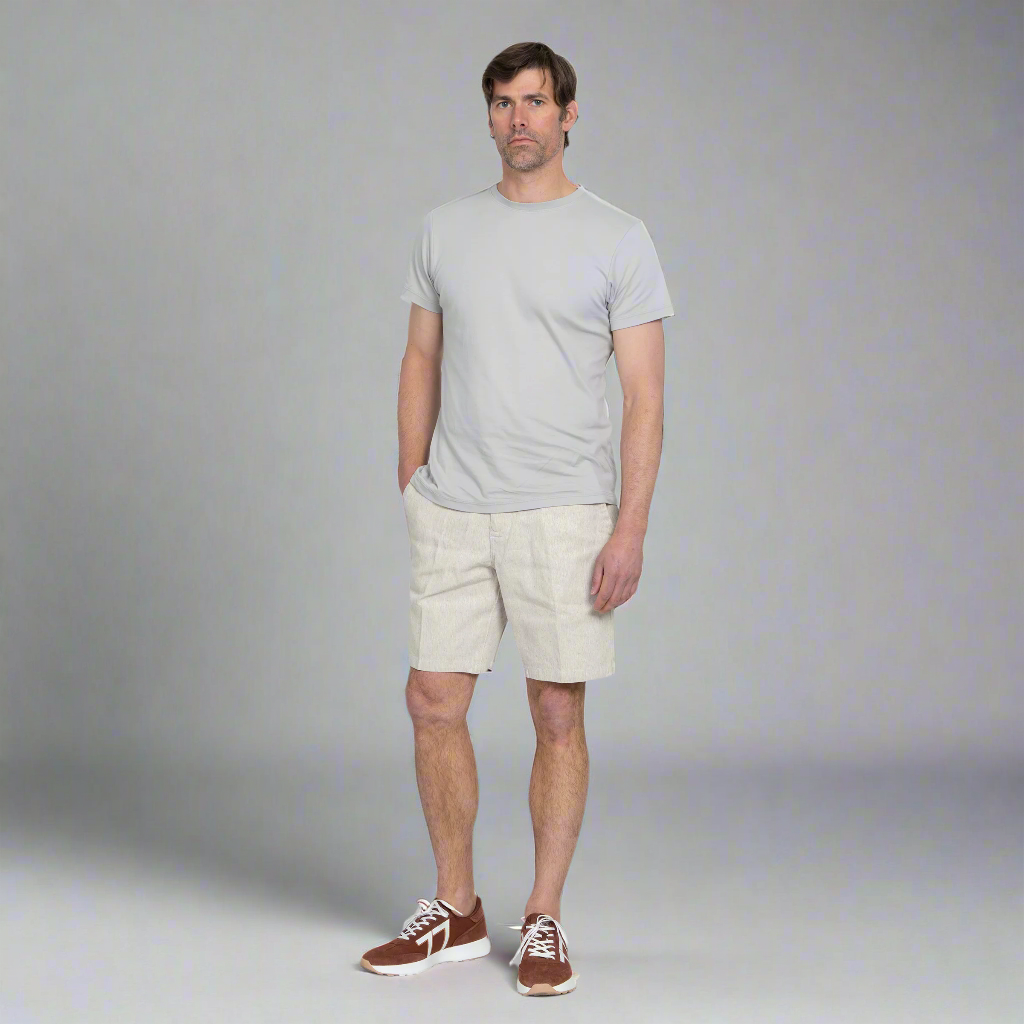 Side view of the hemp shorts showing the 9 inch inseam and slight taper through the thigh.