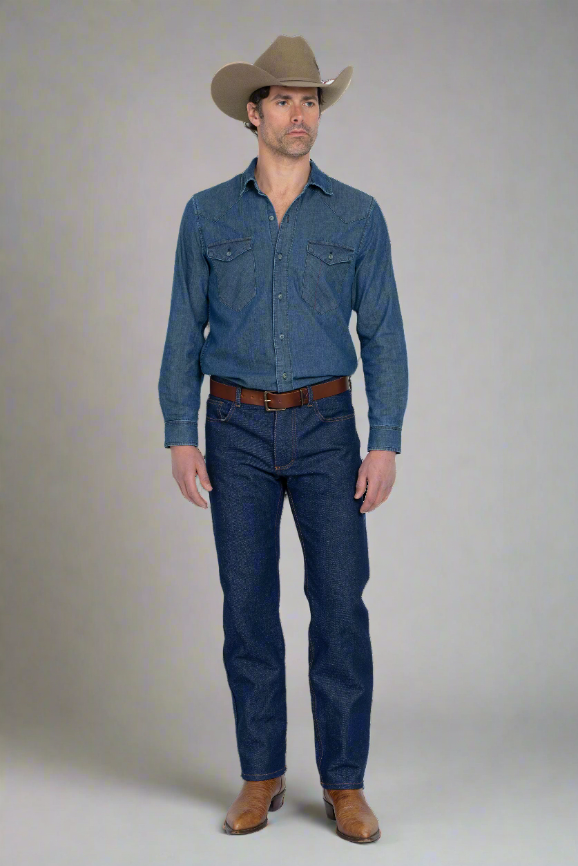 Boot cut hem breaking over a pair of boots