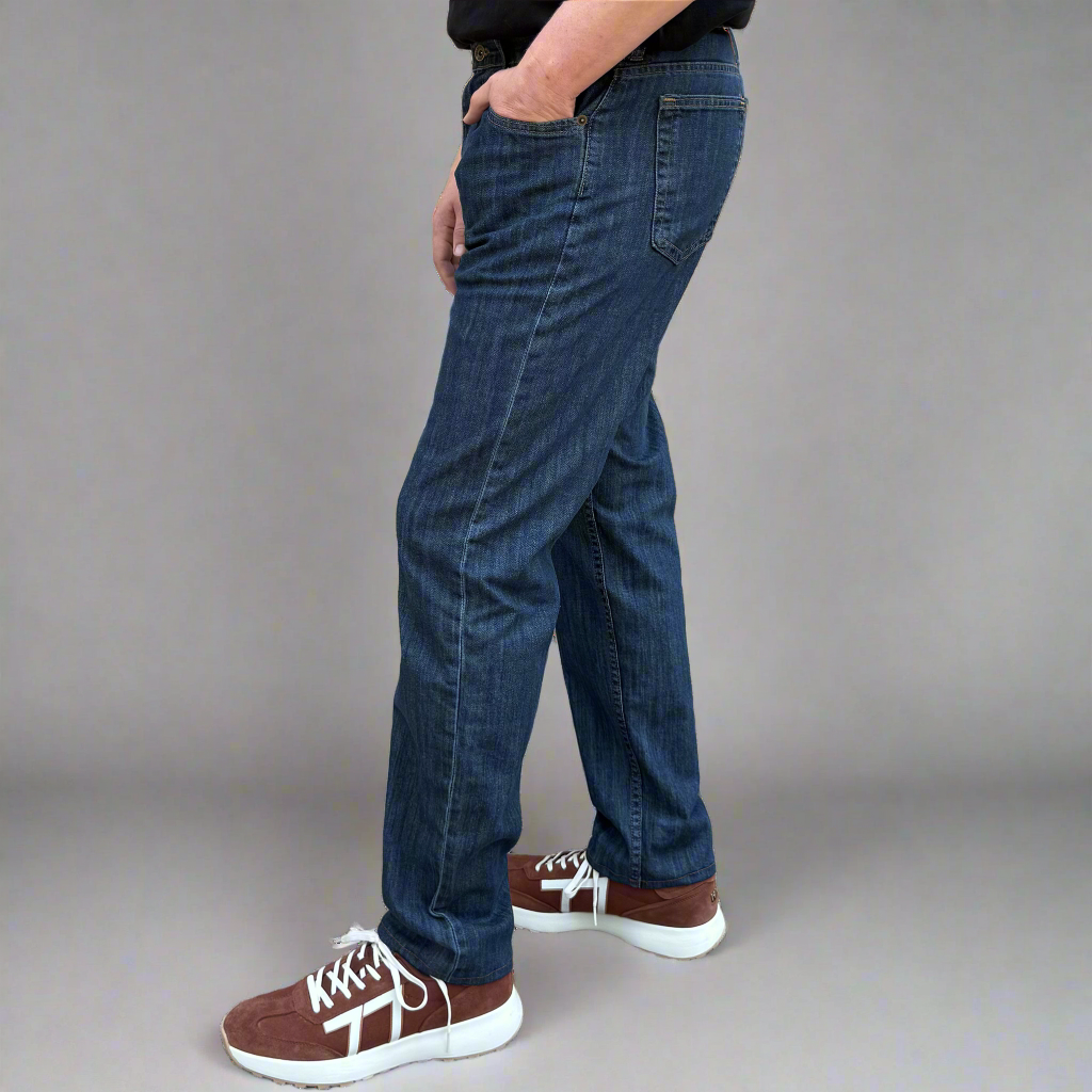 Detail of the front pocket, zipper fly and waistband on the Tailored Fit jeans