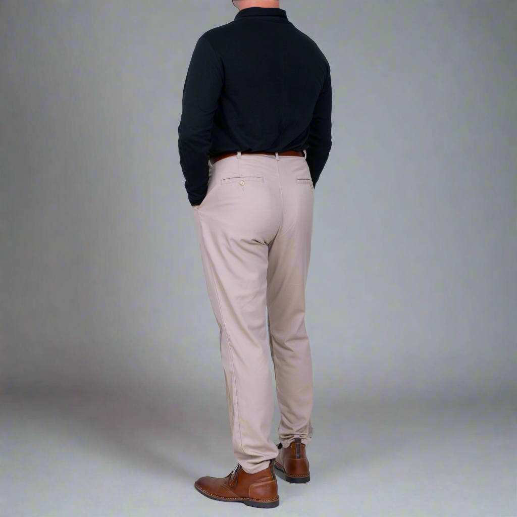 Khaki chinos worn with a shirt tucked in, showing the higher waist.