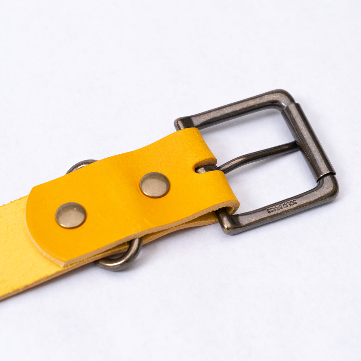 Back side of the olive leather belt showing the leather finish and keeper loop.