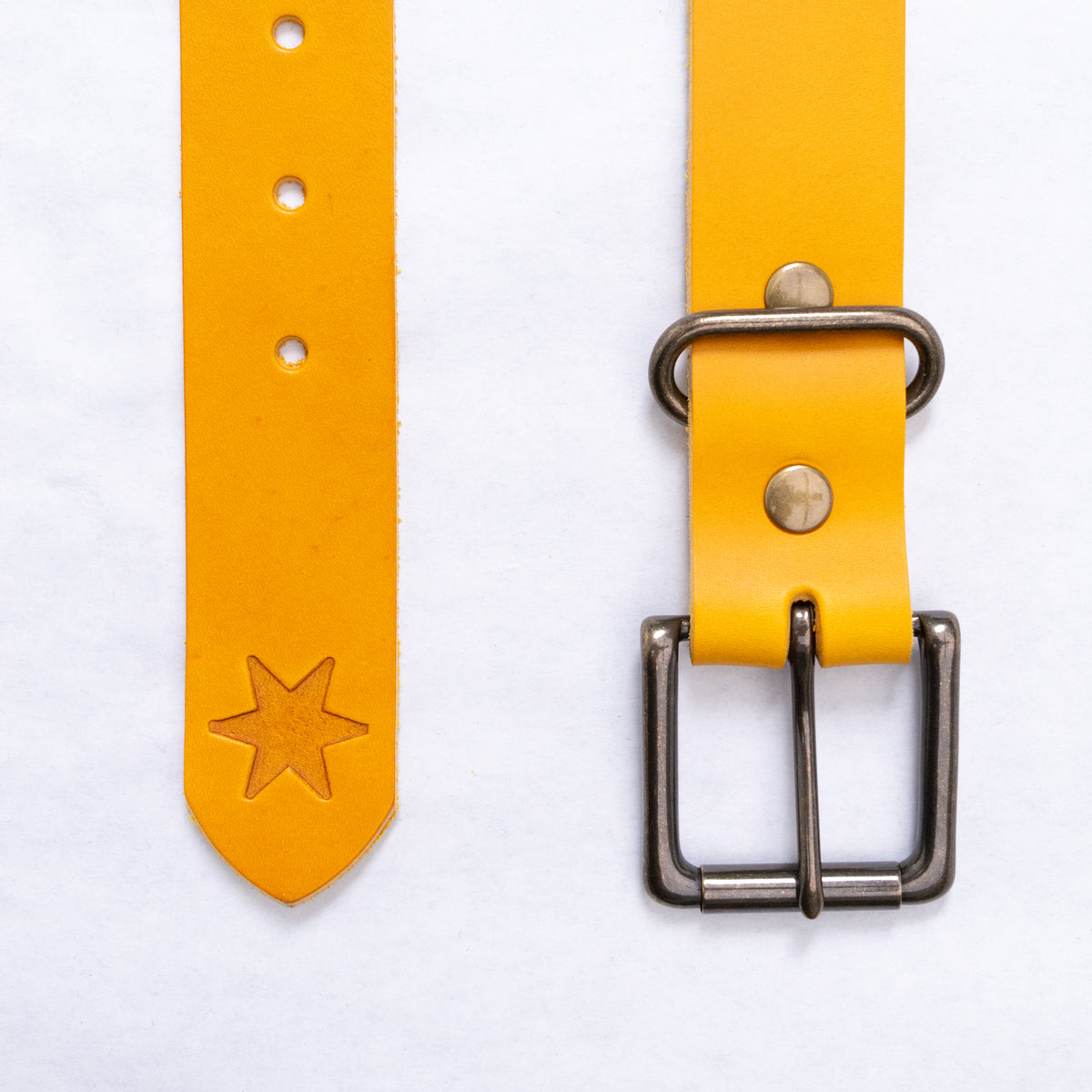 Full length of the olive leather belt laid straight, showing the 1 3/8" wide strap and punched holes.