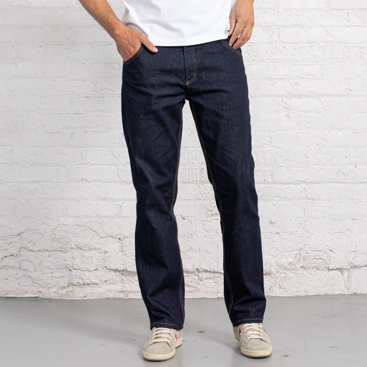 Dearborn Denim Relaxed Fit jeans in dark indigo rinse wash, shown front view with five-pocket styling.