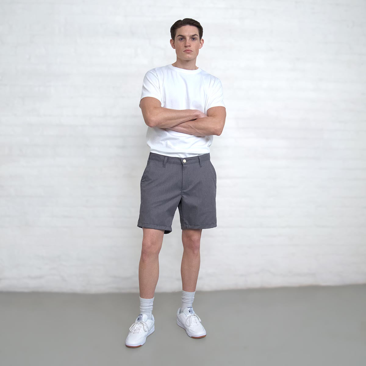 Grey chino shorts shown with the olive and navy colors