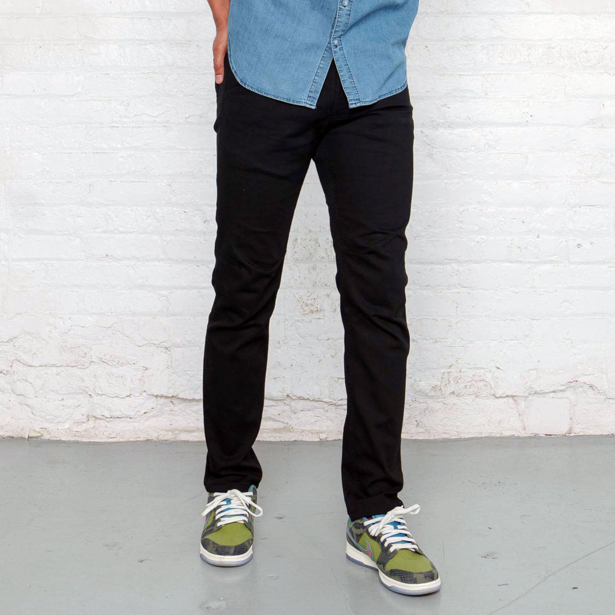 Dearborn Denim Commuter jeans in black denim, front view laid flat.