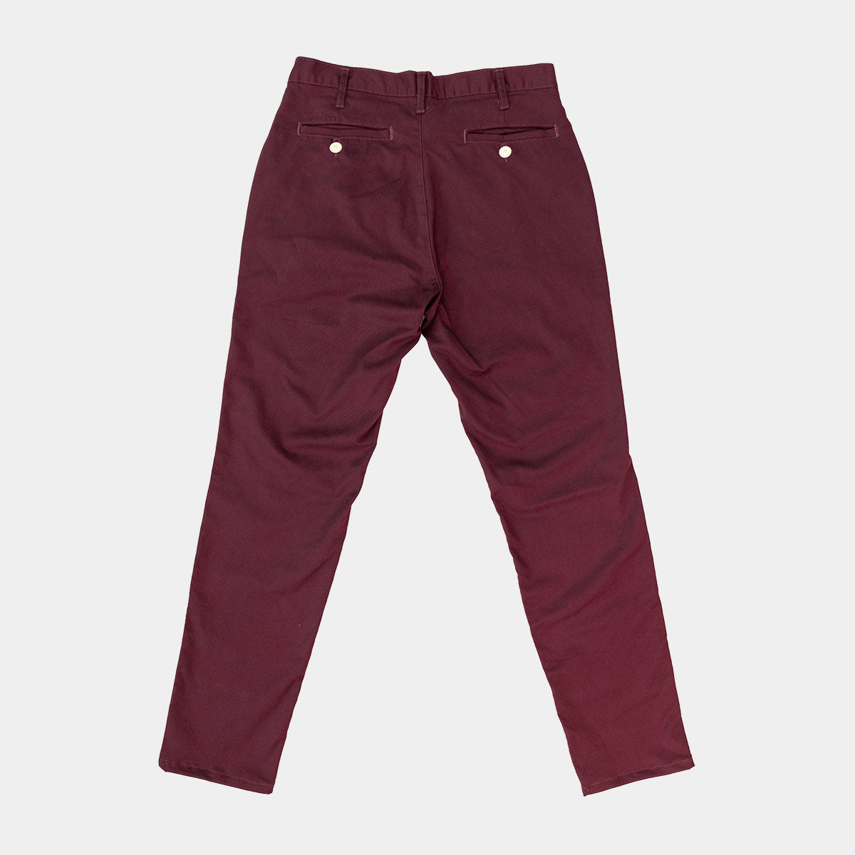 Wine chinos styled with a shirt and belt on a model