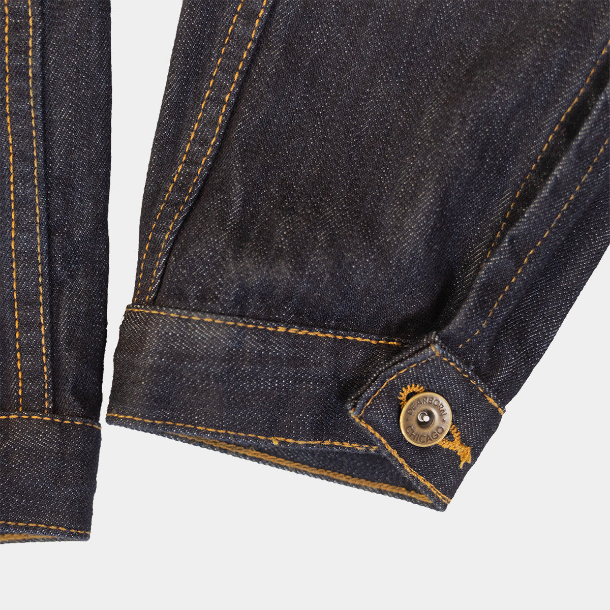 Side view of the denim jacket showing relaxed chest and just-below-waist length