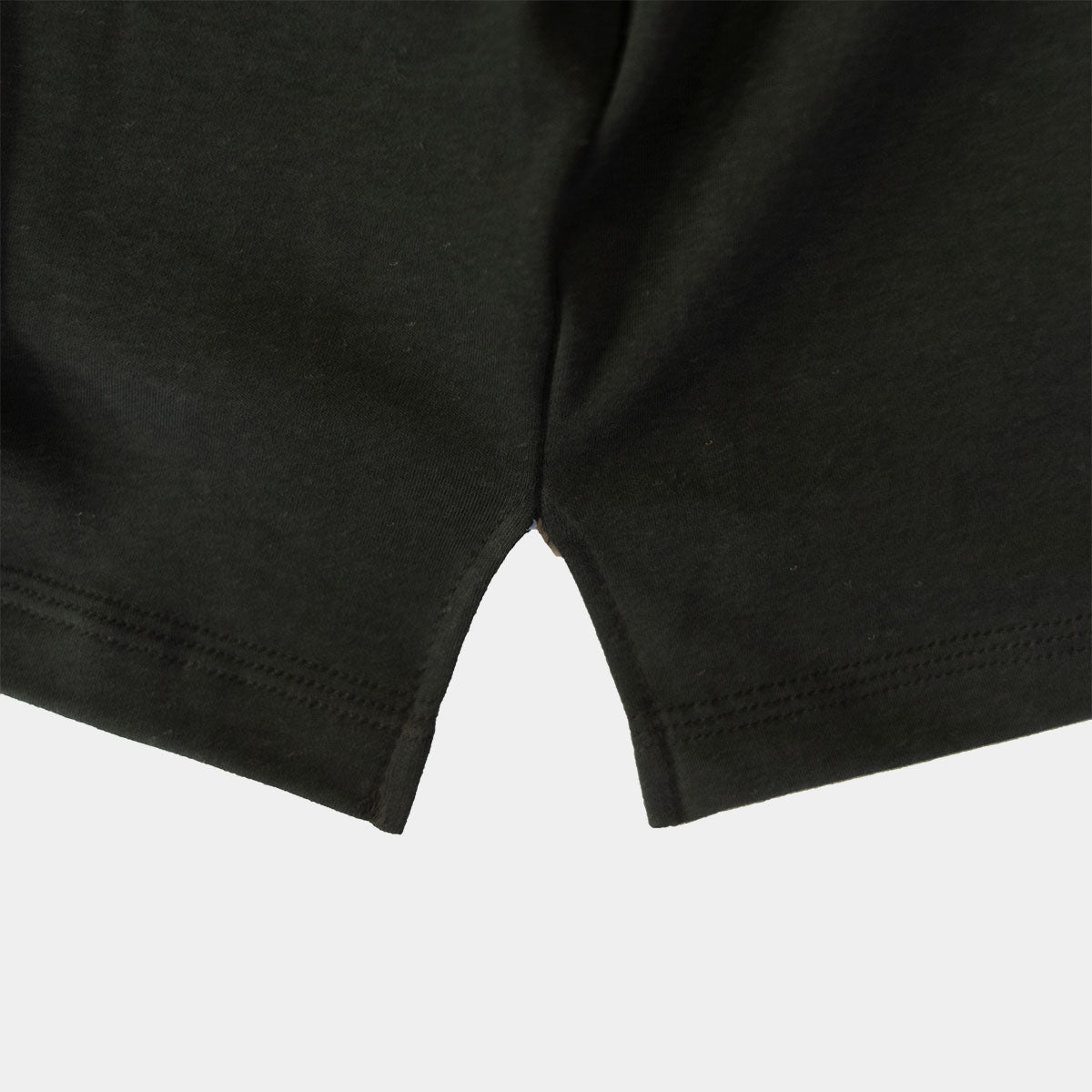Black pocket T-shirt worn with jeans, front view on a model.