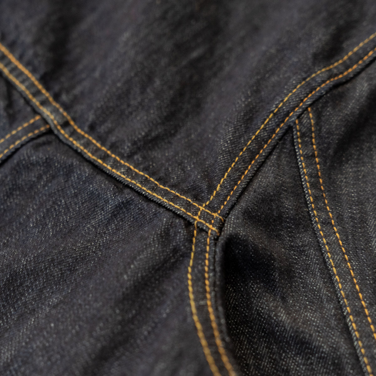 Back view of the dark wash denim jacket showing the yoke and back seams