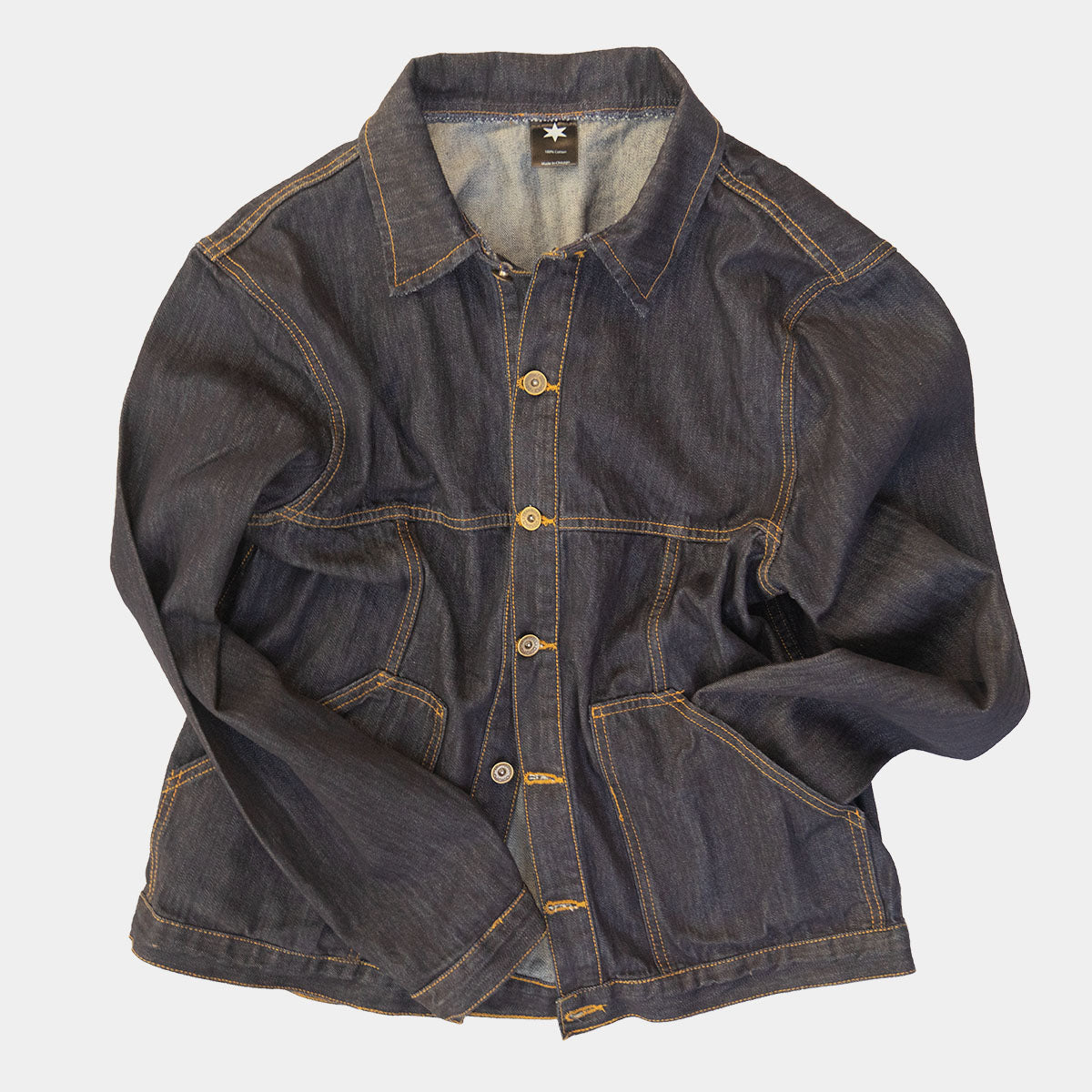 Cuff and sleeve detail of the dark wash denim jacket
