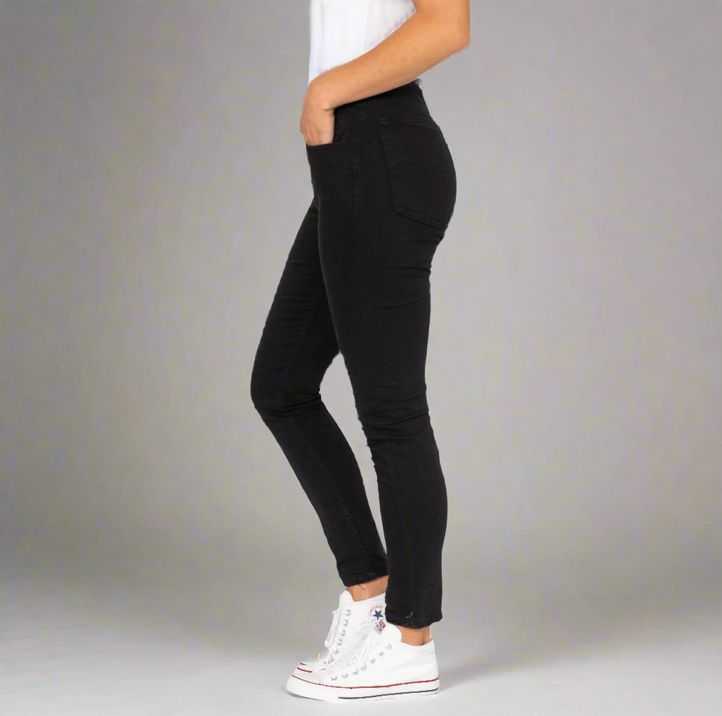 Black high rise skinny jeans shown front on, full length.