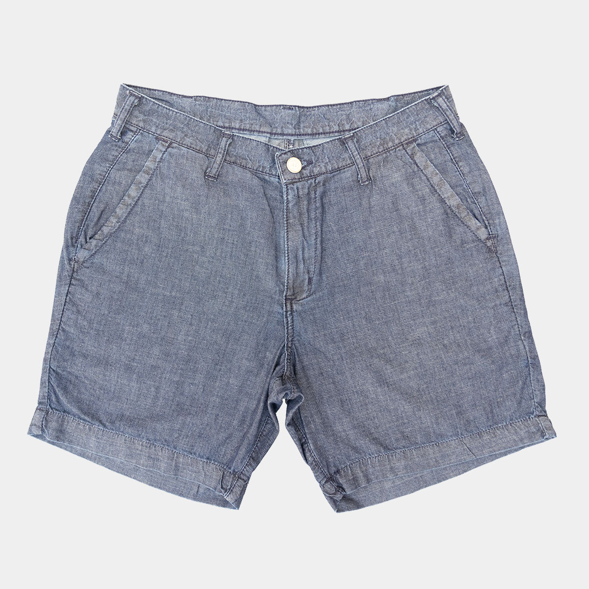 Light blue chambray shorts laid flat, front view with belt loops and two front pockets