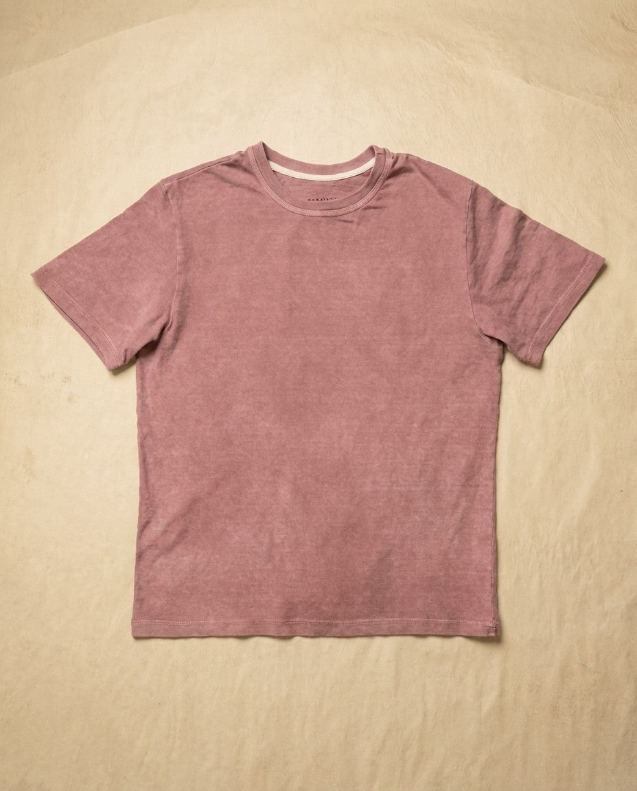 Close-up of the fine gauge interlock knit fabric and sleeve hem.
