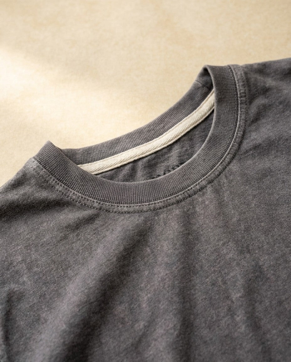 Back view of the Flint T101 t-shirt laid flat, showing the slight taper through the body.