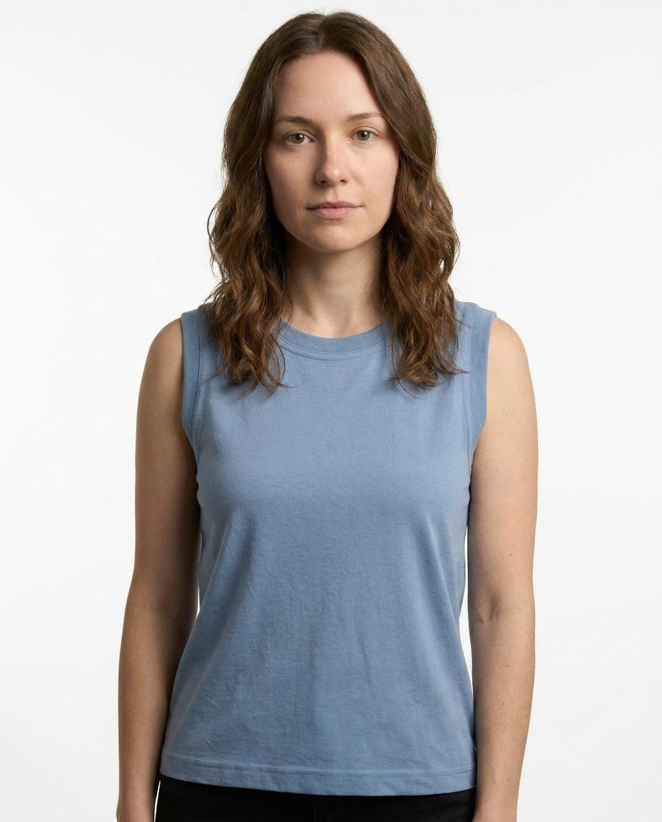 Back view of the blue sleeveless cotton top showing the shoulder and collar seams.