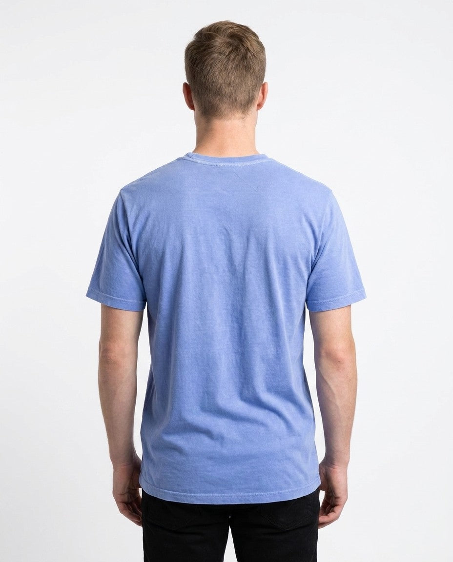 Detail of the fine gauge interlock knit fabric on the sky blue t-shirt.