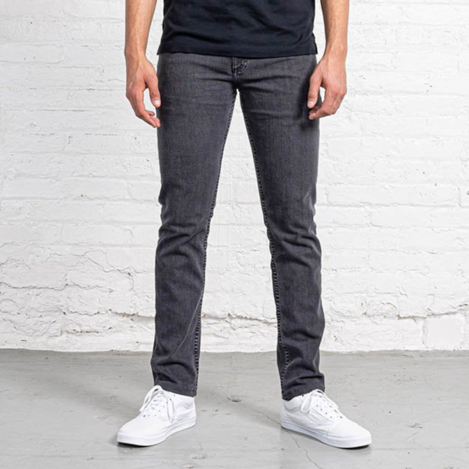 Slim fit grey wash jeans shown flat from the front, with tapered leg, five pockets and a leather patch at the waist.