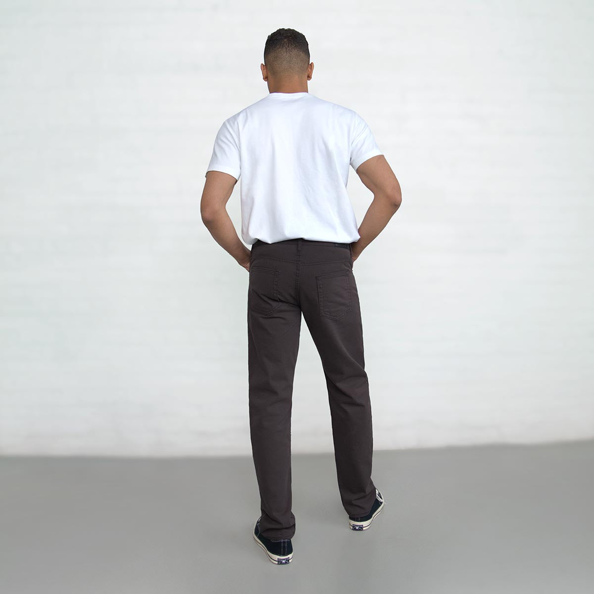 Close-up of the front pocket and coin pocket on the espresso jeans.
