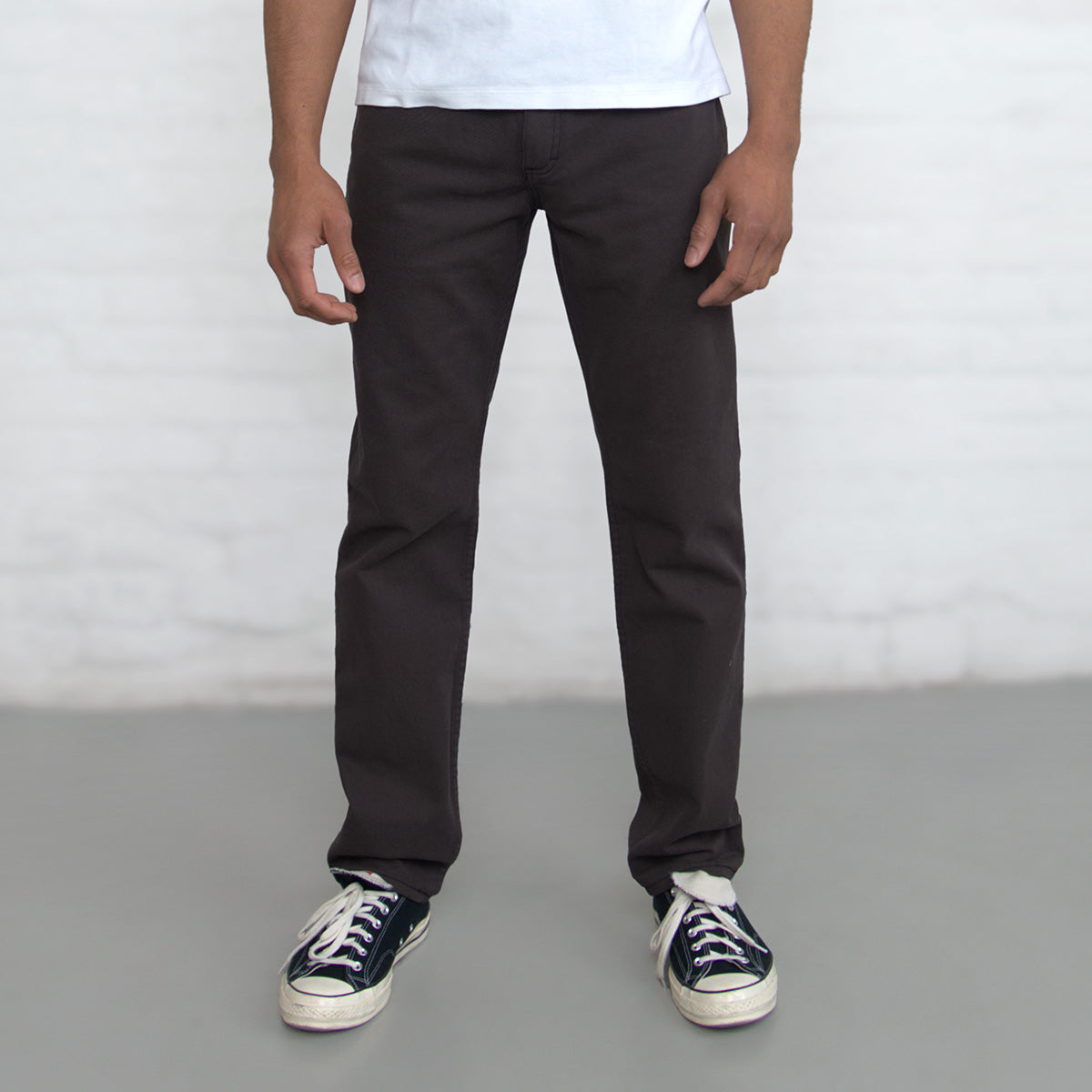 Espresso Tailored Fit jeans shown flat from the front with five-pocket styling and gold leaf button.