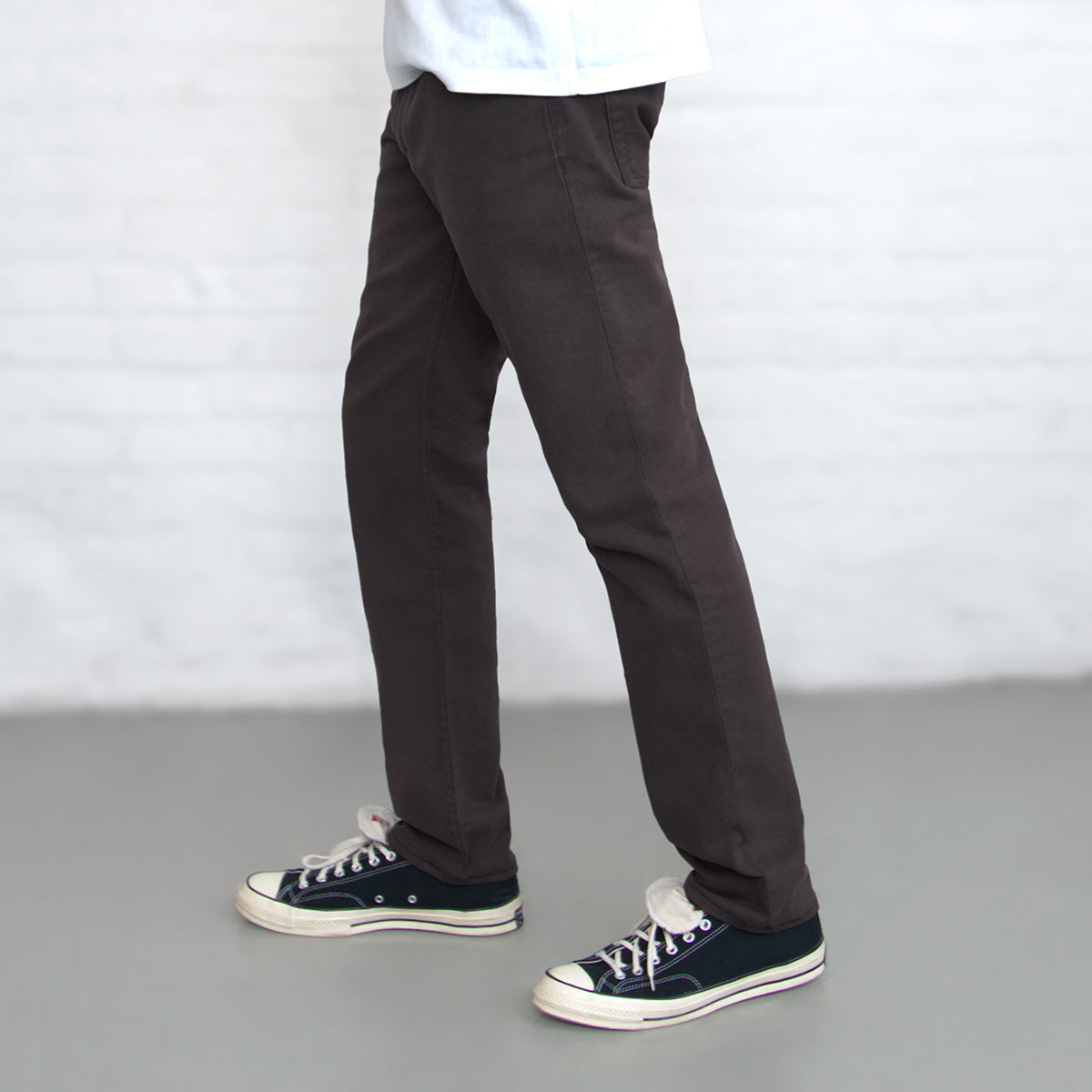 Back view of espresso Tailored Fit jeans showing rear pockets and Horween leather patch at the waistband.
