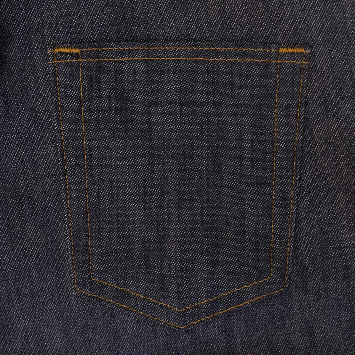 Side view of the tailored fit jeans showing the taper below the knee.