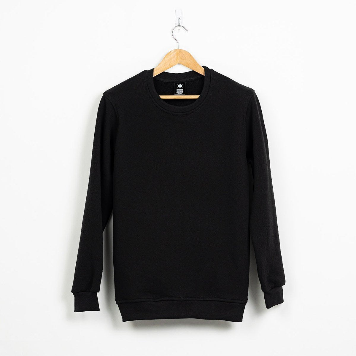Detail of the three thread fleece knit texture on the black sweatshirt