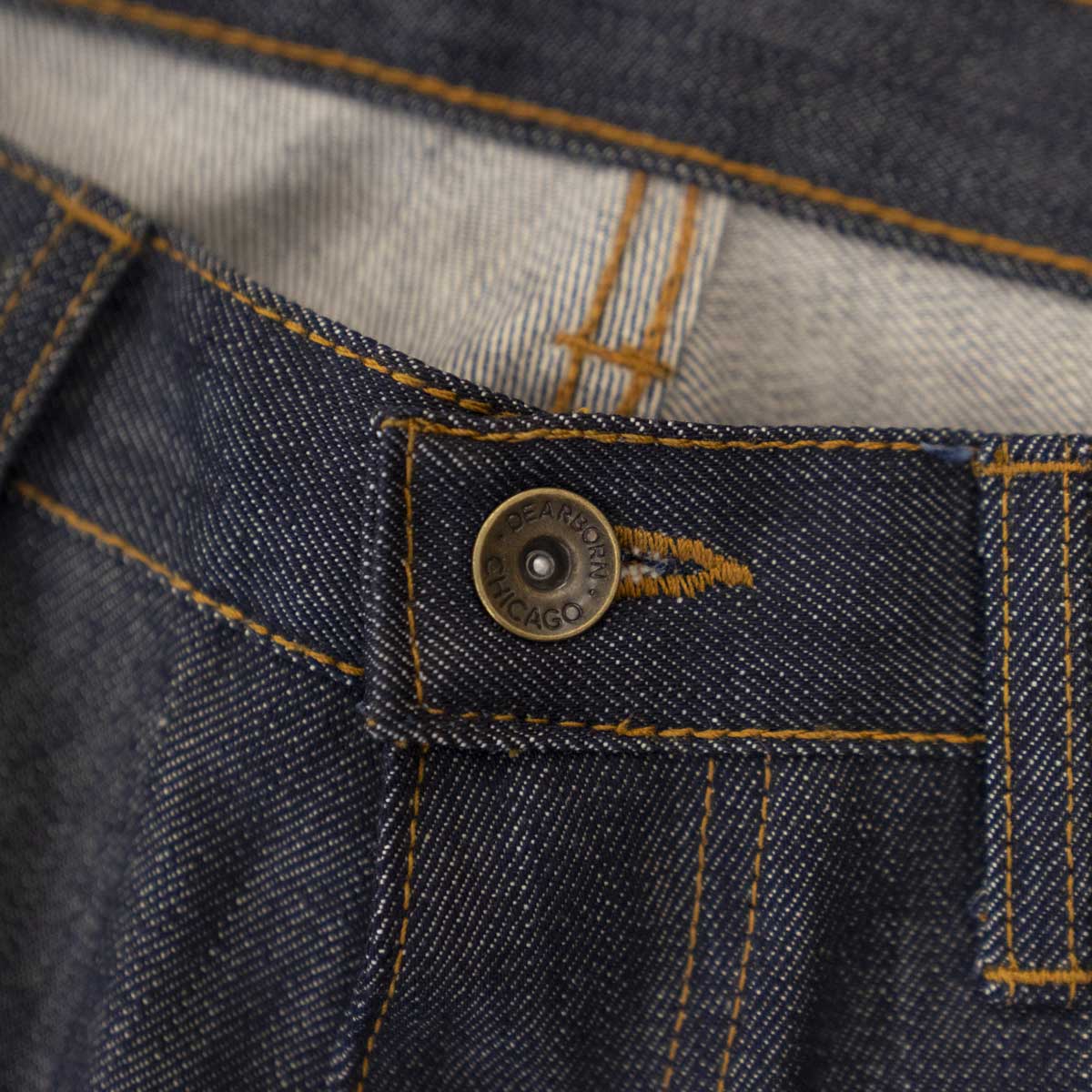 Back view of raw selvage jeans showing pockets and the Horween leather patch at the waistband.