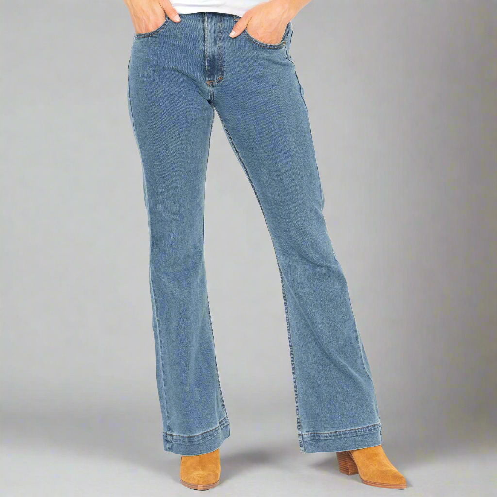 Light wash high-rise flare jeans shown full length on a model, front view.