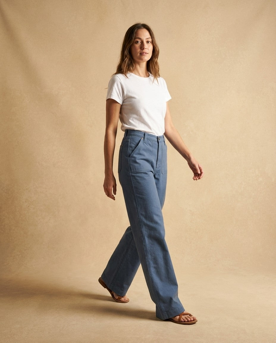 Front view of the Palazzo wide leg jeans in blue denim, worn with a high waist and full leg.