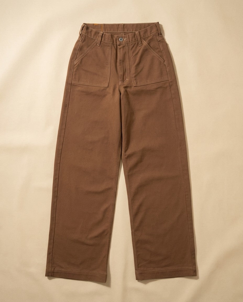 Detail of brushed brown 13oz cotton denim fabric and stitching.