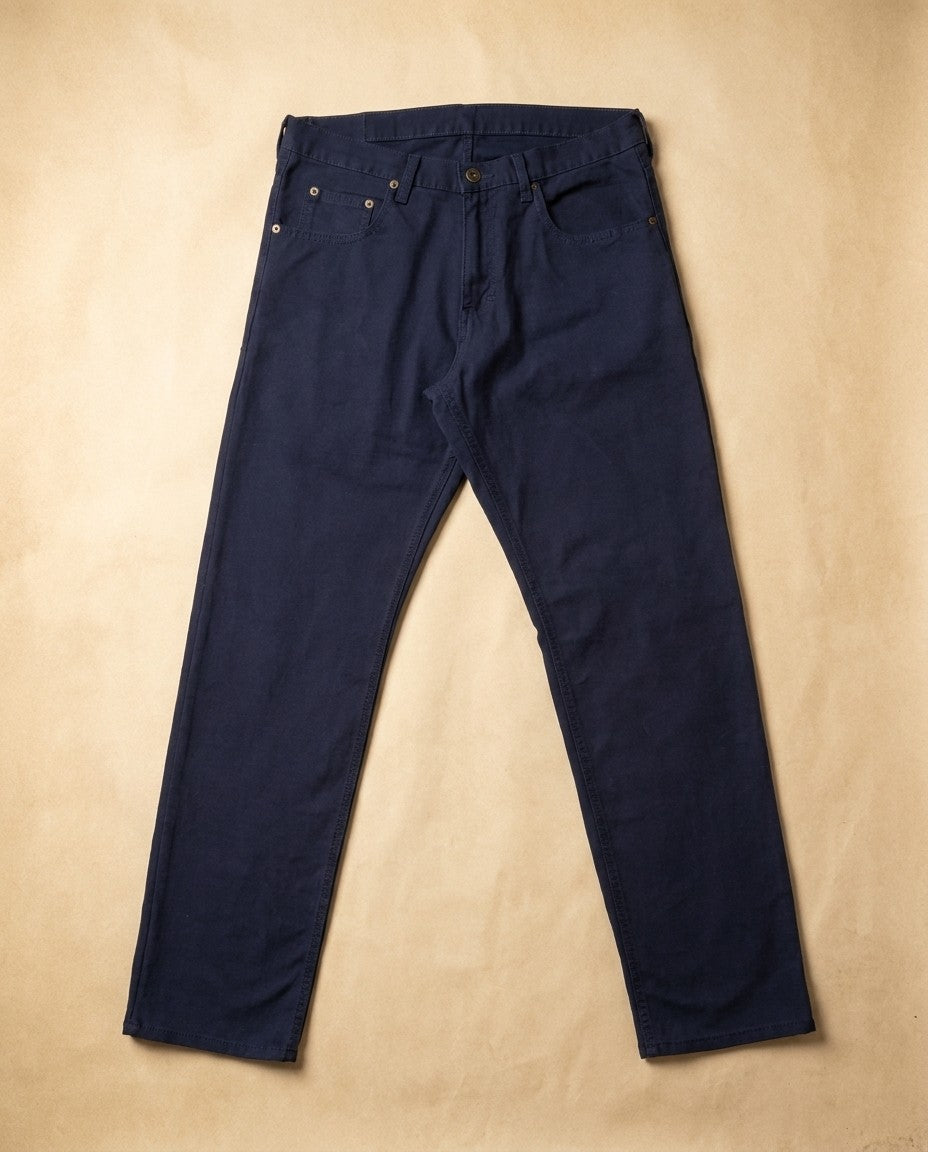 Back view of Blue Norther Tailored Fit jeans showing back pockets and Horween leather patch at the waistband.