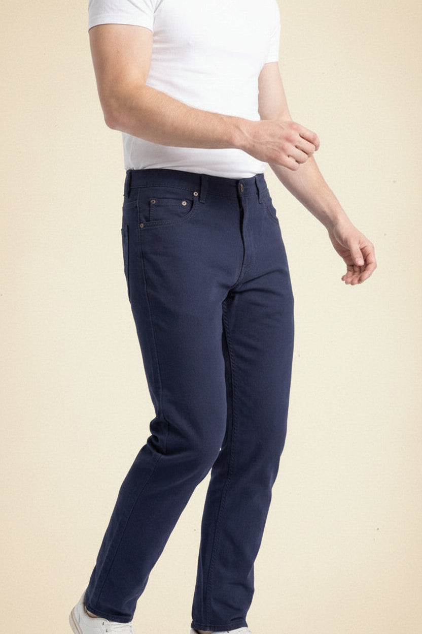 Close-up of Blue Norther stretch denim showing the wash, gold leaf button and stitching detail.