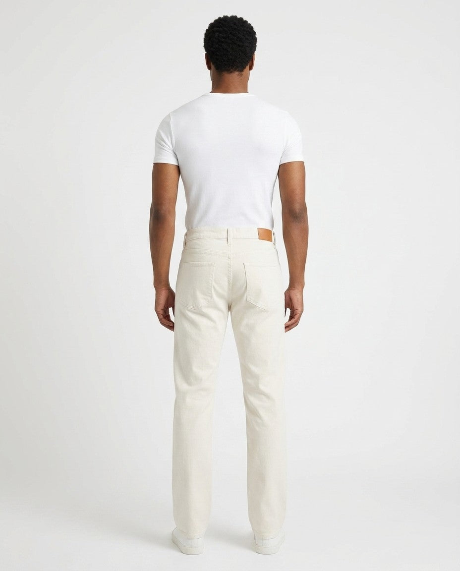 Close-up of the gold leaf button, YKK zipper fly and belt loops on the Milk wash jeans.