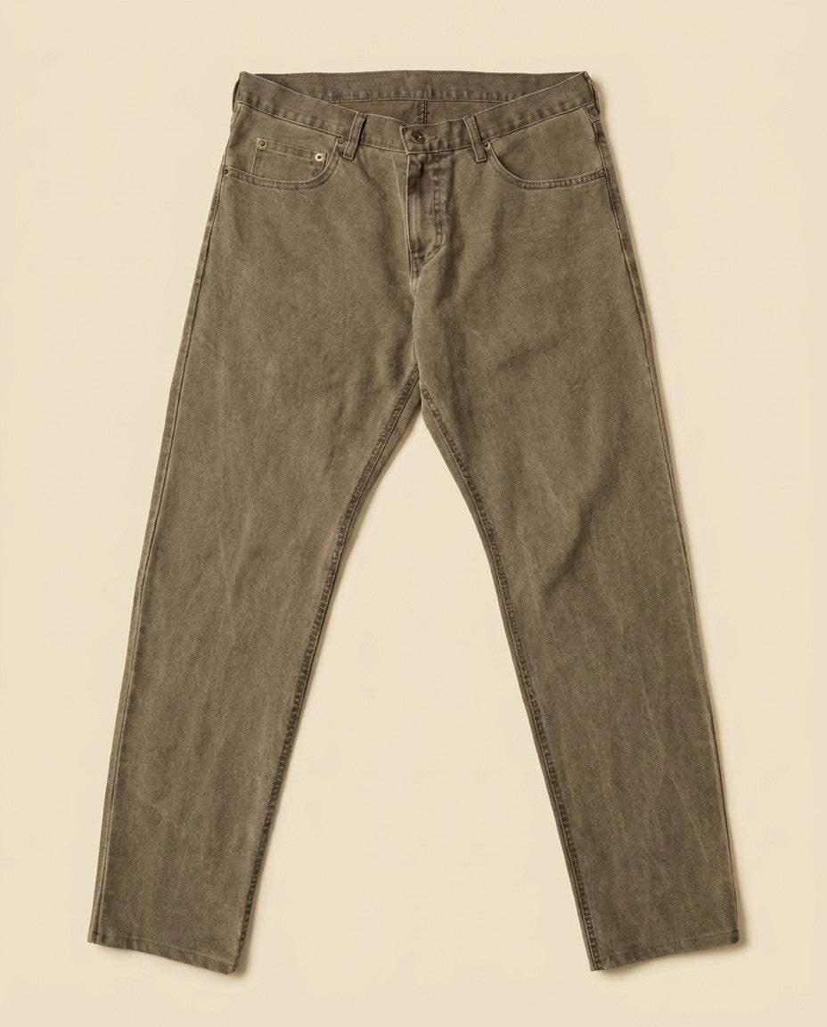 Close-up of Mica stretch denim showing the specialty wash, gold leaf button and stitching.