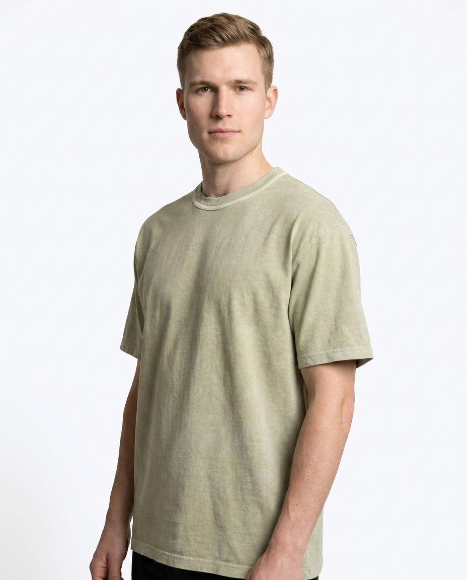 Three folded moss green t-shirts stacked together in the 3-pack.
