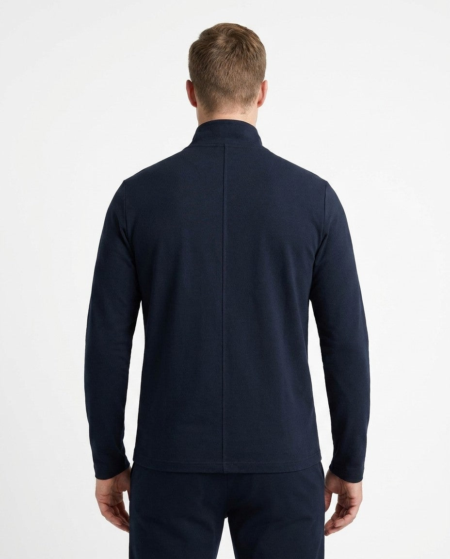 Back view of the Aspen Turtleneck showing the smooth interlock knit surface.