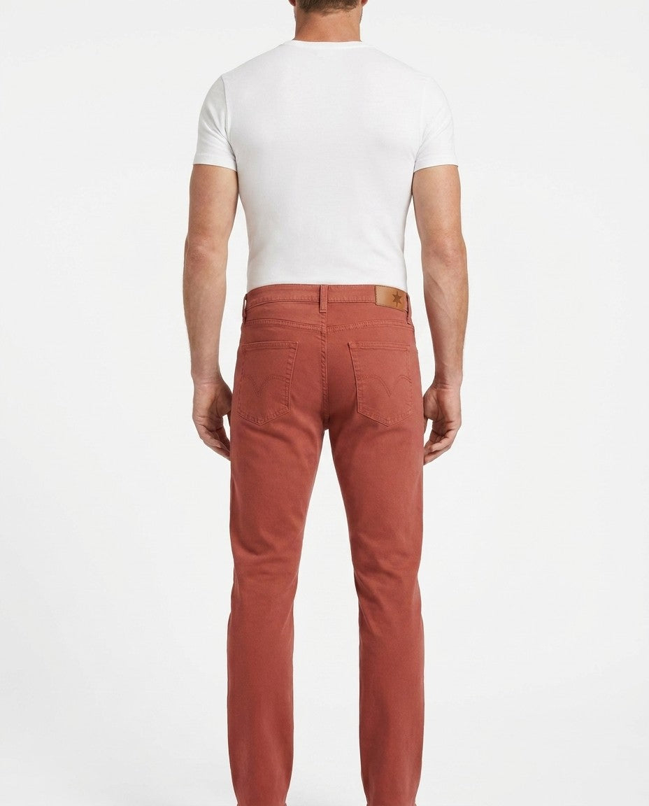 Close-up of Red Ochre stretch denim showing weave, stitching and front pocket.