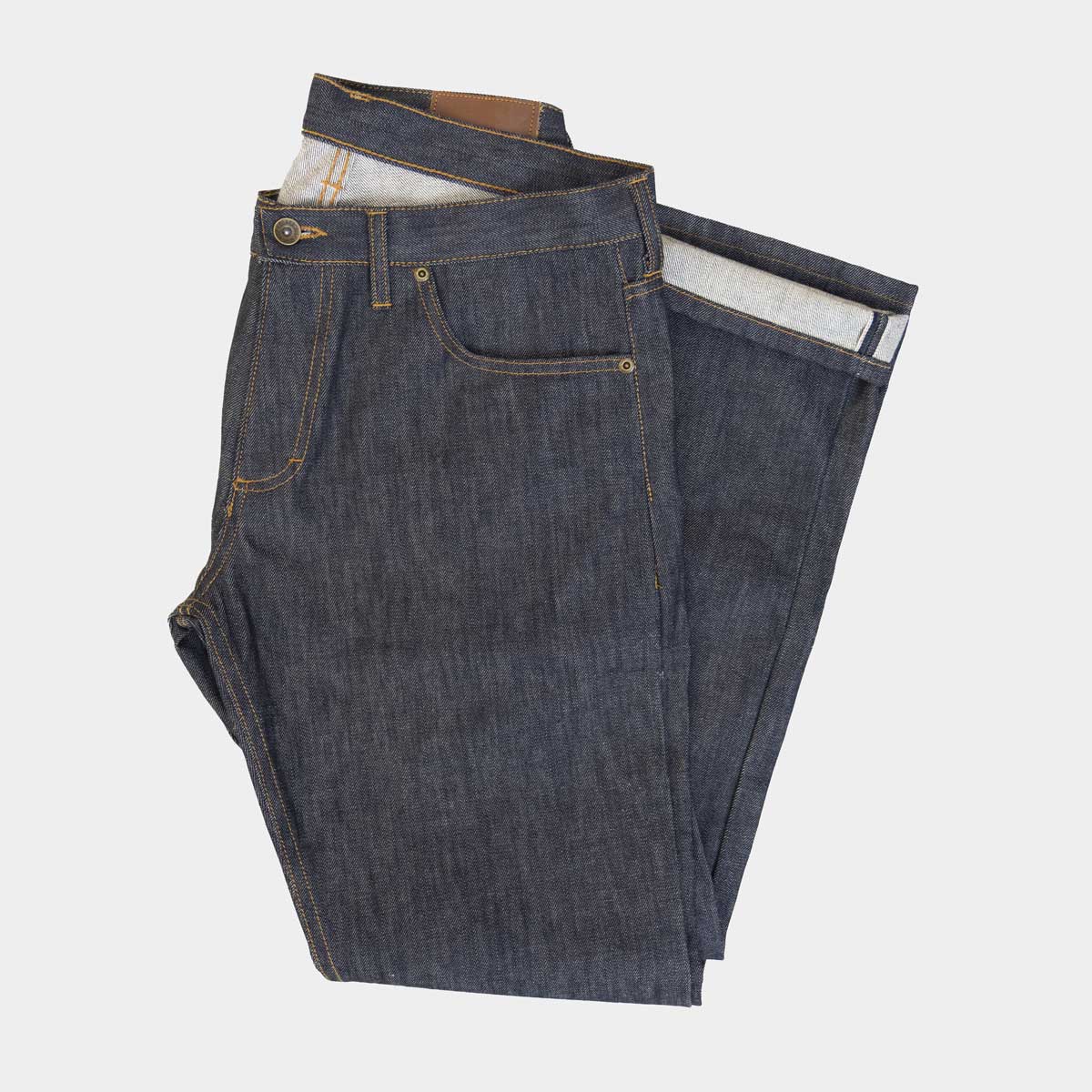 Tailored fit Cone Mills White Oak selvage jeans in raw indigo, shown flat from the front.