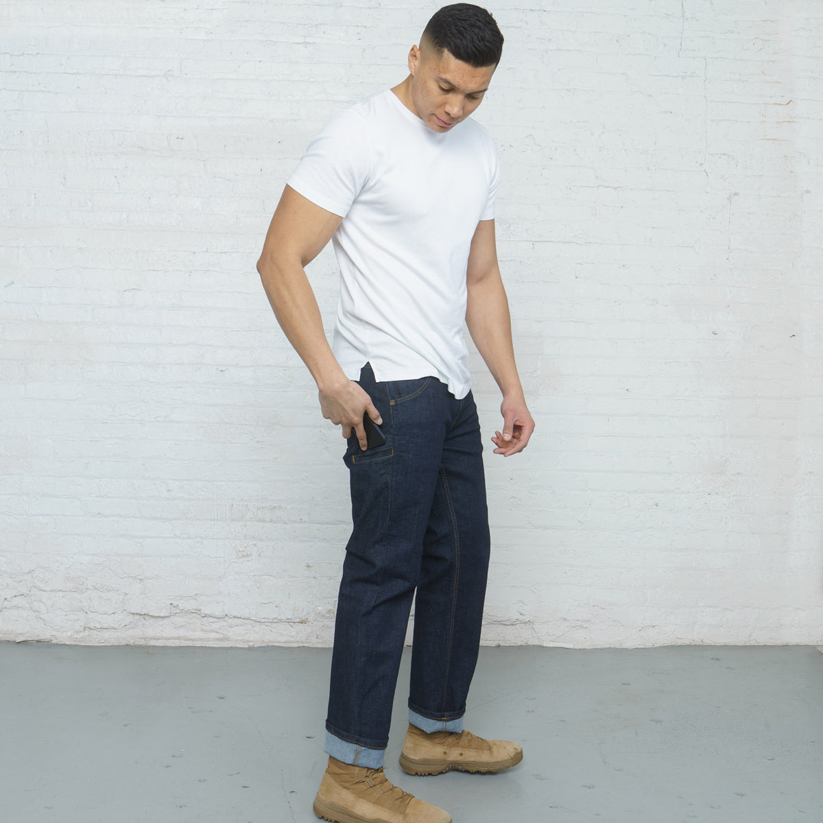 Side view of relaxed fit jeans showing the sixth side phone pocket
