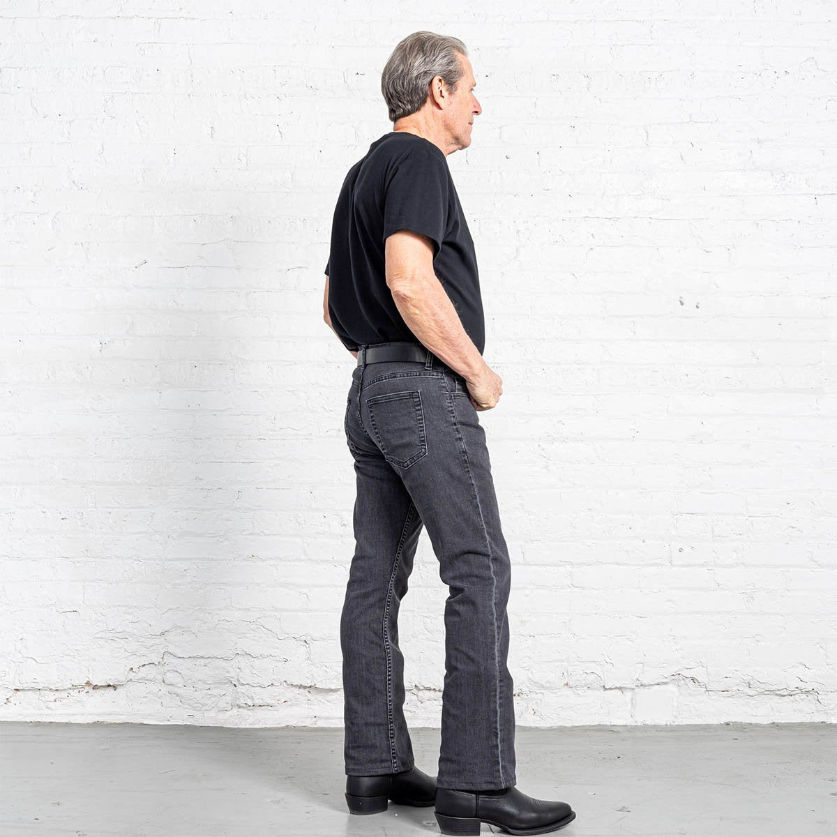 Horween leather patch on the back waistband of the grey wash jeans