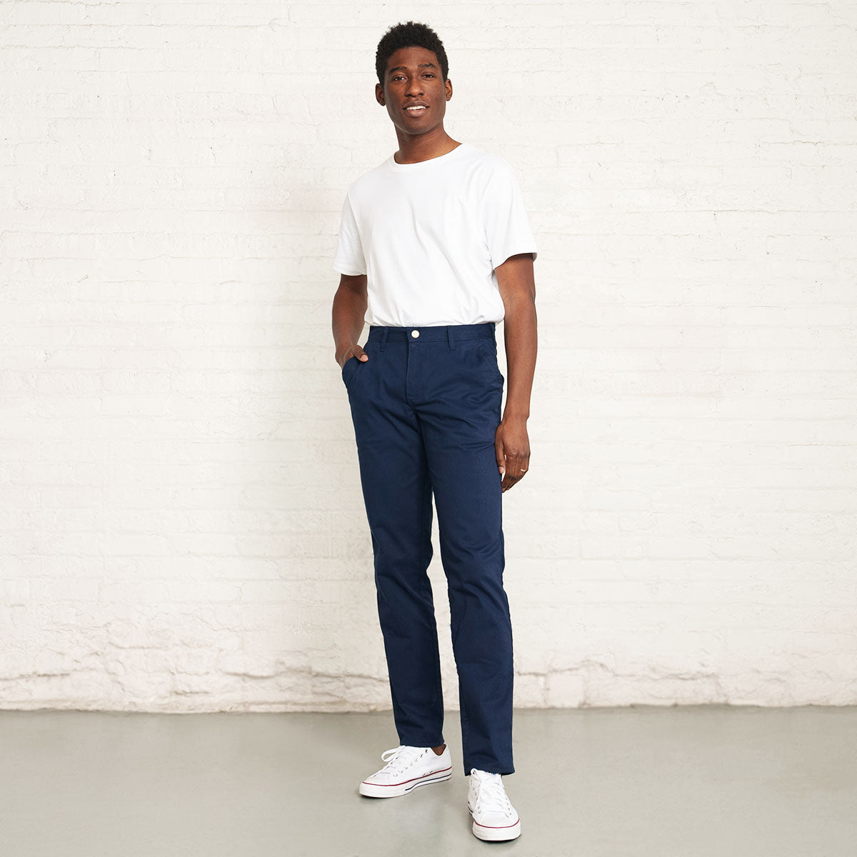 Back view of the navy stretch chino showing button closure welt pockets.