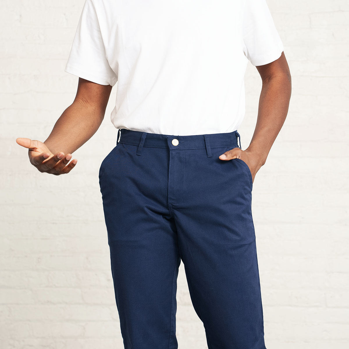 Man wearing the navy stretch chino, full-length front view.