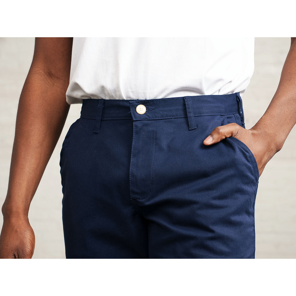 Close view of the medium rise and front fly on the navy chino.