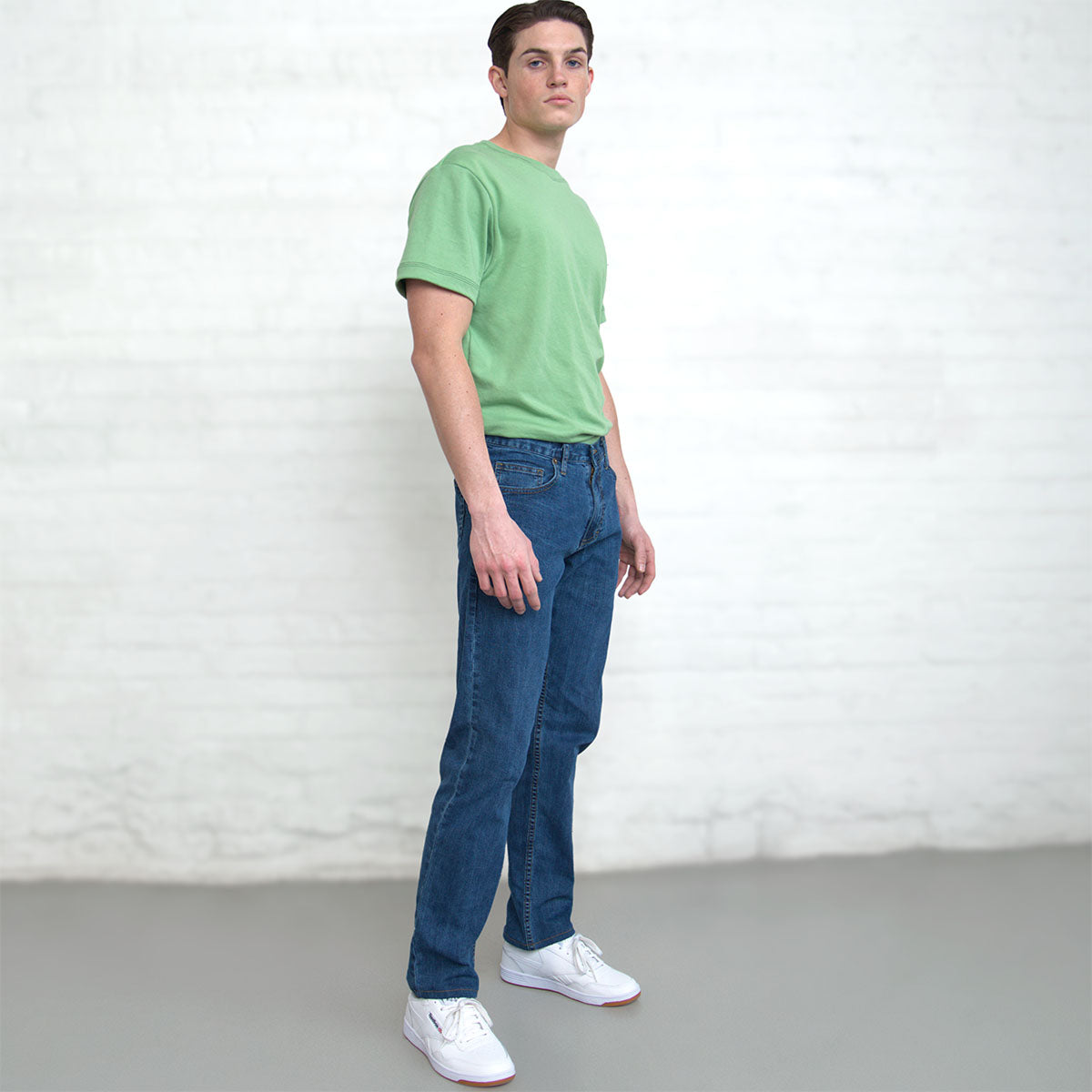 Detail of the notched sweep at the hem of the jade t-shirt