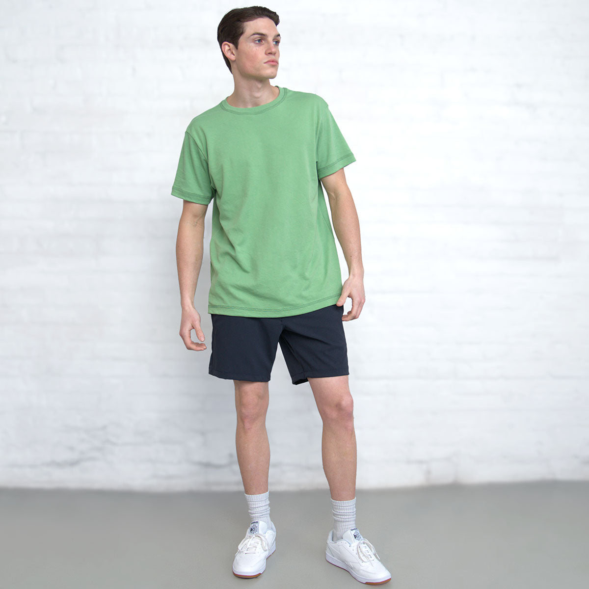 Close-up of the fine gauge interlock knit fabric in jade green