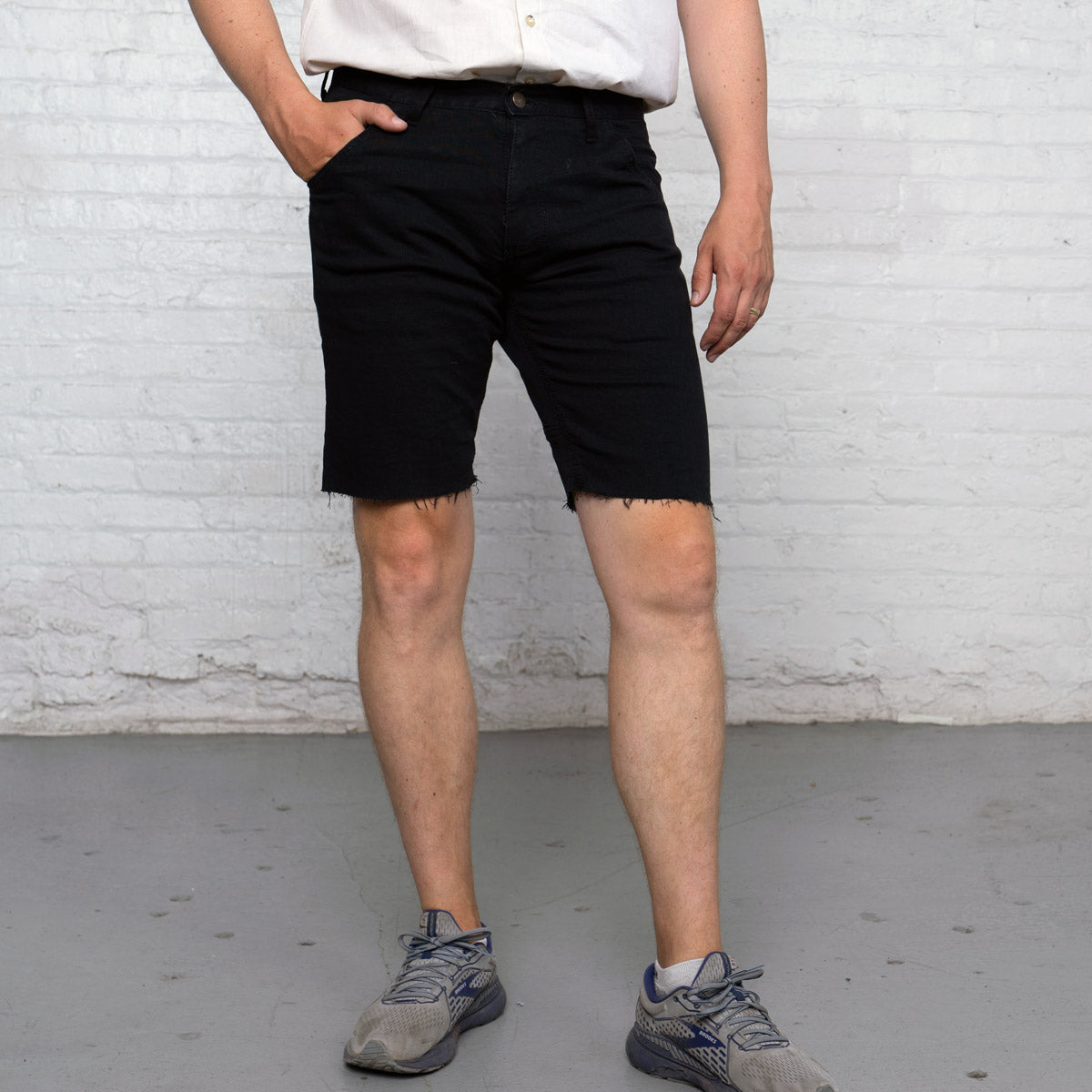 Back view of black commuter shorts showing the two-ply seat and back pockets.