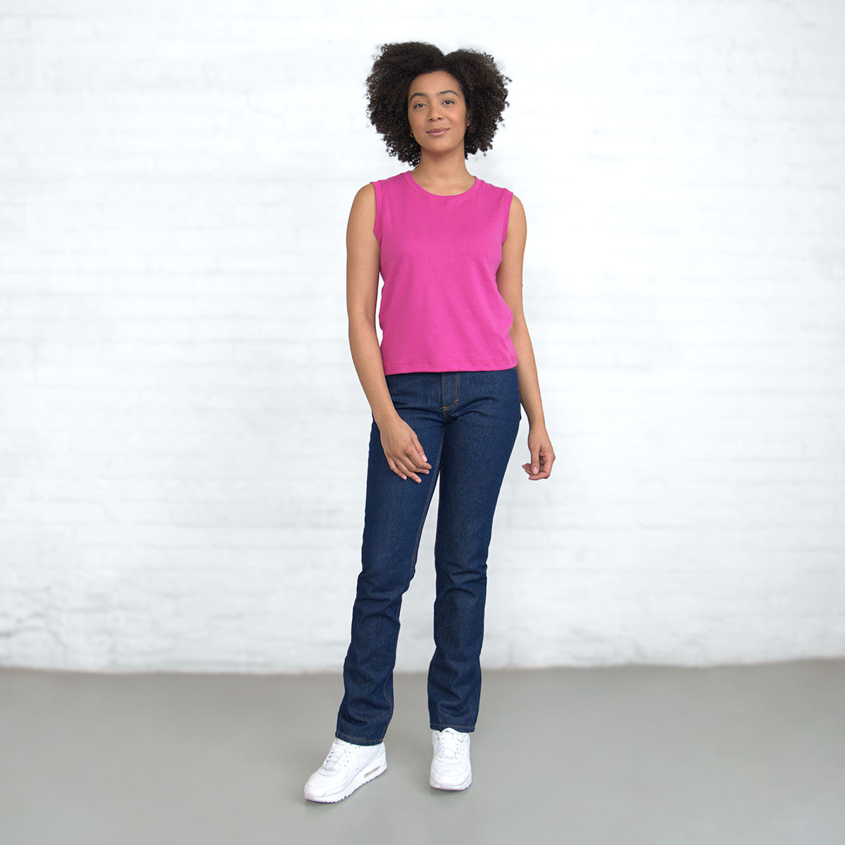 Shoulder and neckline of the magenta sleeveless crop top