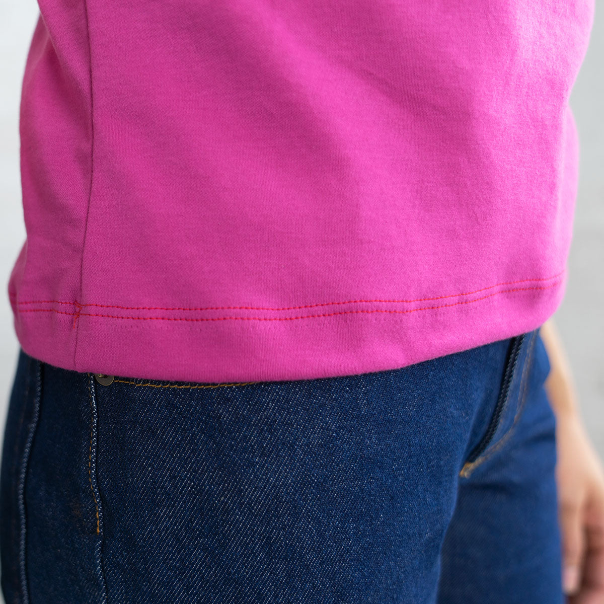 Magenta crop top shown laid flat