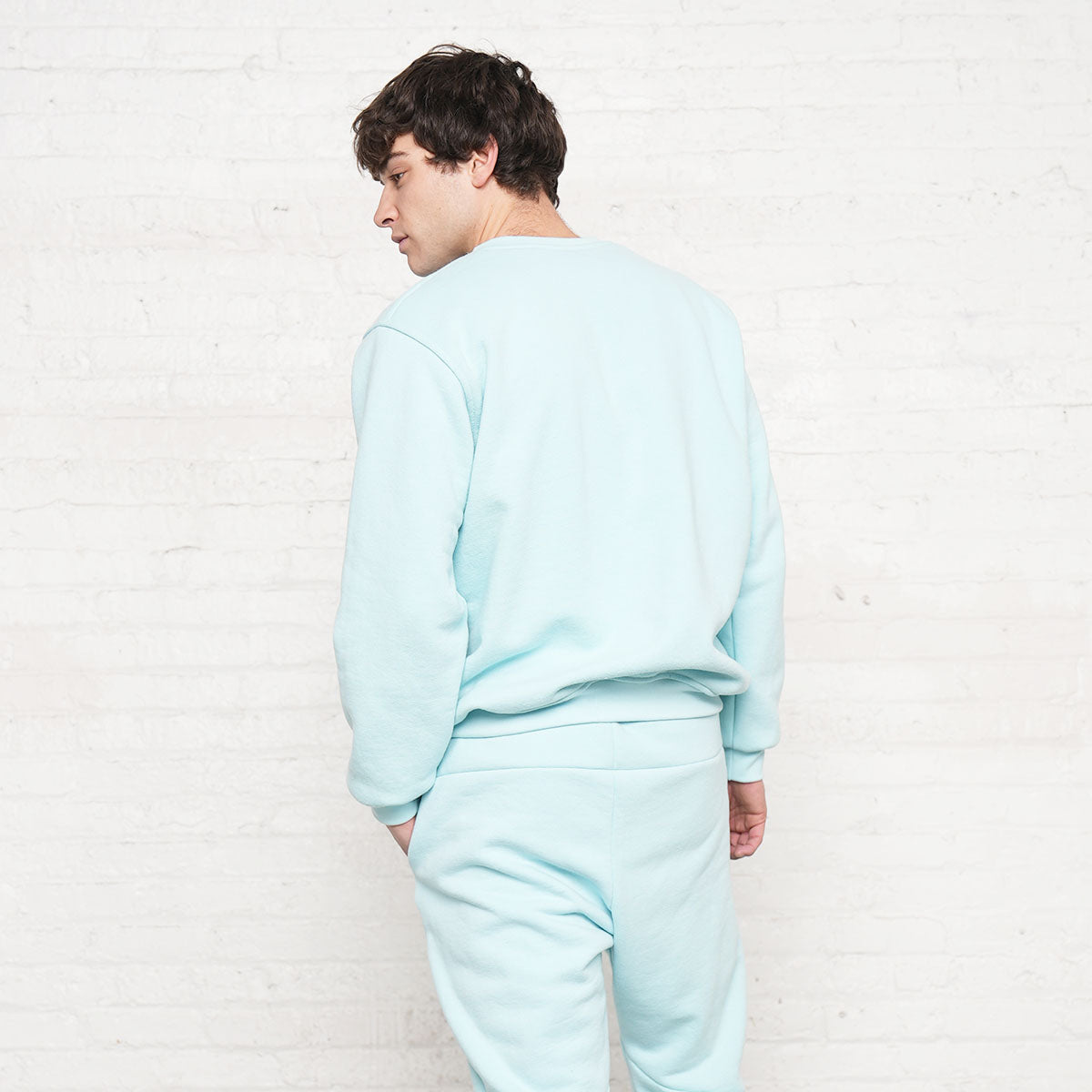 Model wearing the sweatshirt, side view